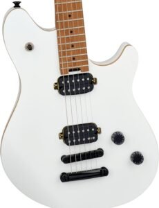 EVH Wolfgang Standard Tuna-Matic electric guitar in Cream White leaning against a vintage amplifier in a dimly lit studio