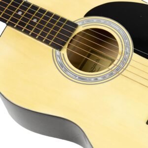 Person holding a full-size acoustic guitar with a strap, ready to practice